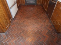 Interior brick floors with years of built up sealer.