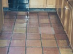 Mexican Saltillo pavers with dis-colored grout and years of heavy sealer build-up.