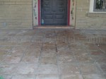 Mexican Saltillo paver tile with peeling sealer, water damage and heavy sealer build-up.